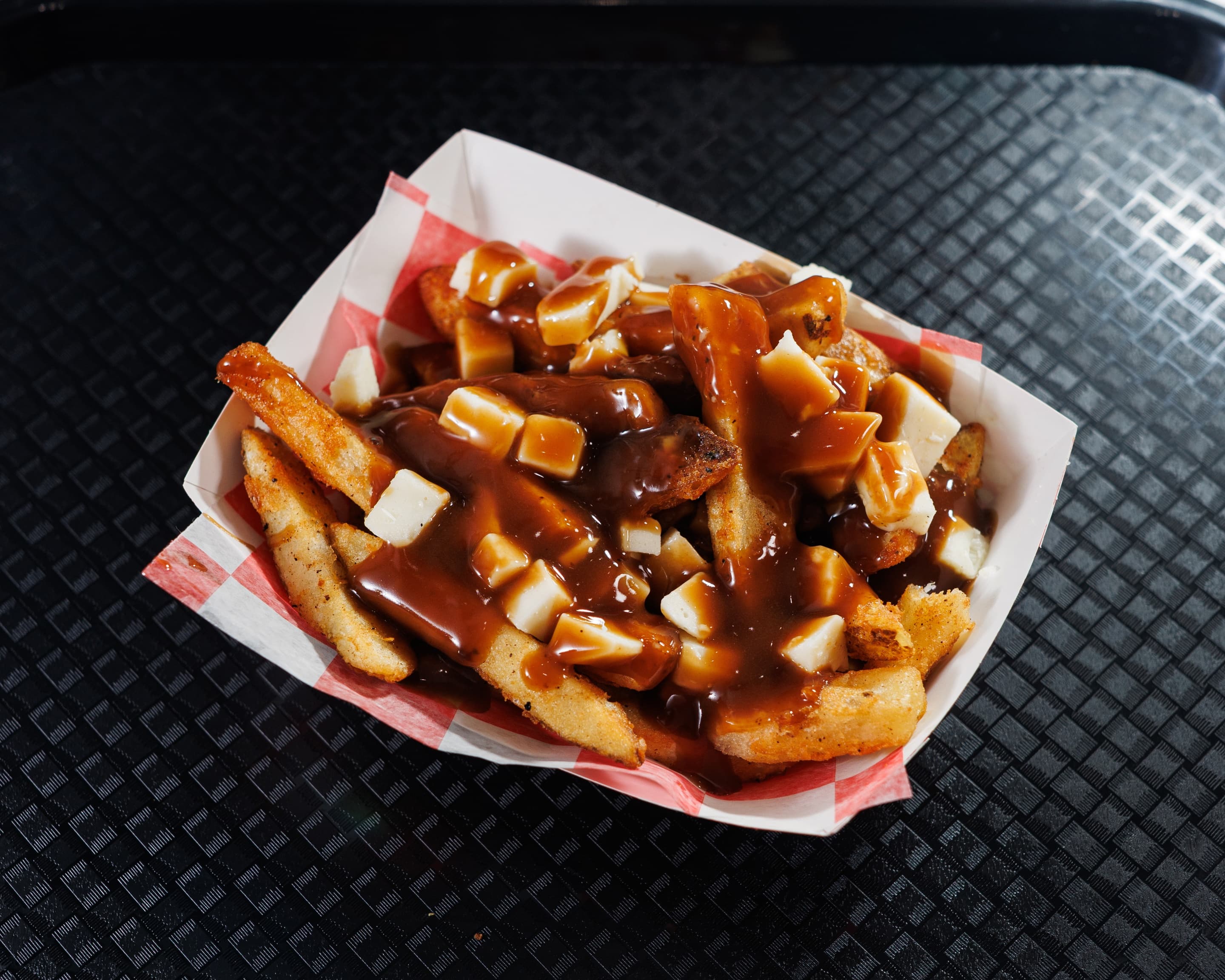 LBC Poutine with crispy fries, cheese curds and brown gravy